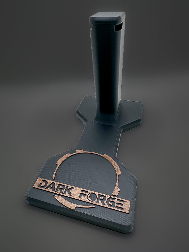 Darkforge Wraith and Reaper 2011 display stand with black shaped base and bronze-tone Dark Forge logo on a charcoal background