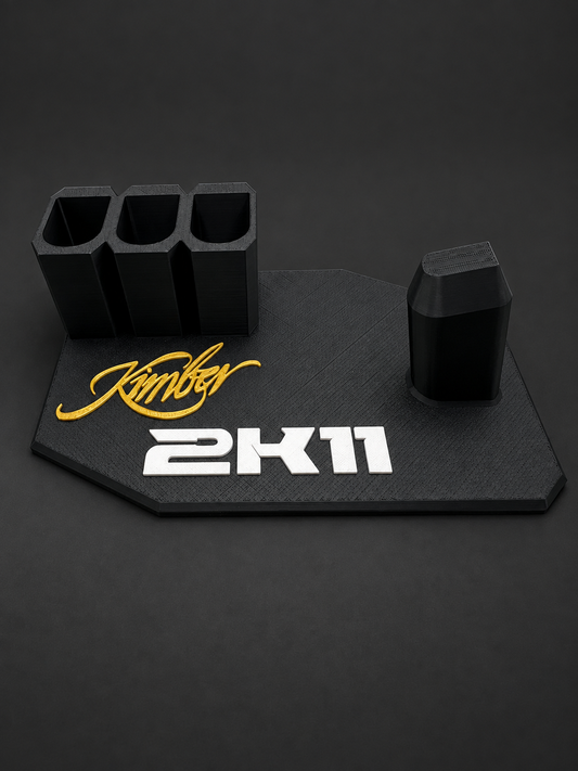 Kimber 2K11 Black & Gold Display Stand – 3 Magazine Holders, black polymer stand with gold and white markings on a charcoal background