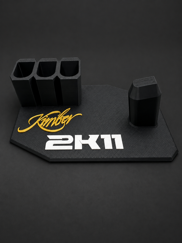 Kimber 2K11 Black & Gold Display Stand – 3 Magazine Holders, black polymer stand with gold and white markings on a charcoal background